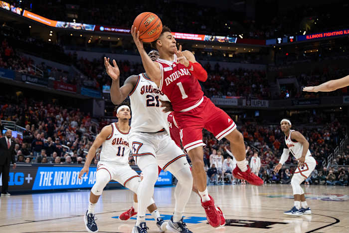 Mar 11, 2022; Indianapolis, IN, USA; Indiana Hoosiers guard Rob Phinisee (1) passes the ball while Illinois Fighting Illini center Kofi Cockburn (21) defends in the second half at Gainbridge Fieldhouse. Mandatory Credit: Trevor Ruszkowski-USA TODAY Sports
